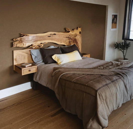Live edge wooden headboard with built-in shelf in a modern bedroom setting, featuring natural wood grain and organic design